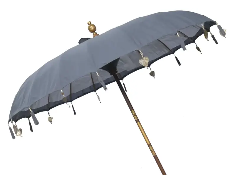 Product image of the product “Bali umbrella , dark grey 2 with wooden coins and gold leaves hanging around the edge. Approx. 230cm dia. and 250cm height ”